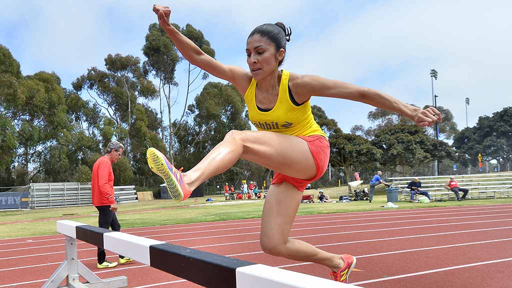 Nadia Hernandez Morales, 38, won her group of the 2,000-meter steeplechase in 8:05.89. Photo by Ken Stone