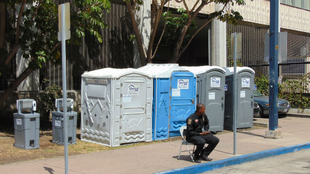 Portable toilets and hand washing stations near City Hall