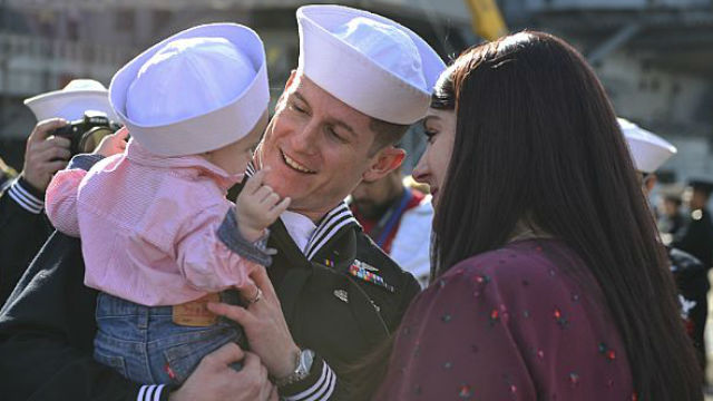 Navy airman meets baby daughter