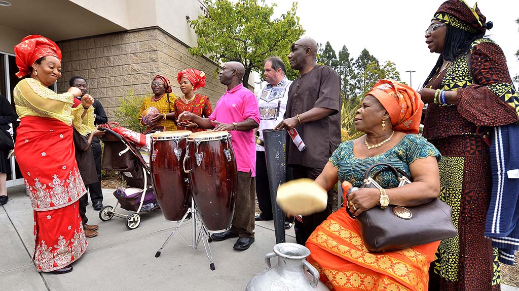 An African-American group provide music before the Mass.
