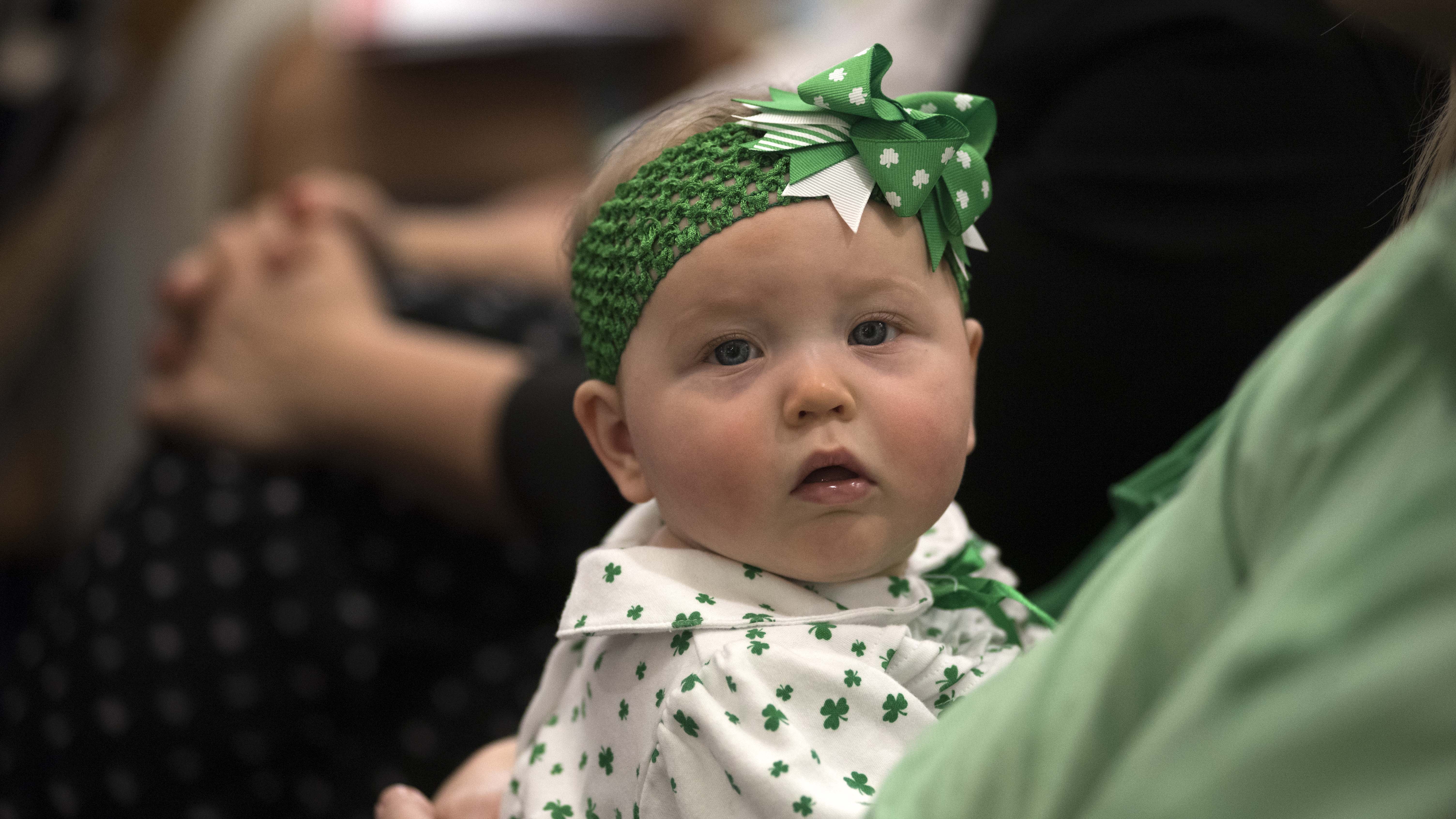 An Irish family dressed their baby in shamrock clothing.