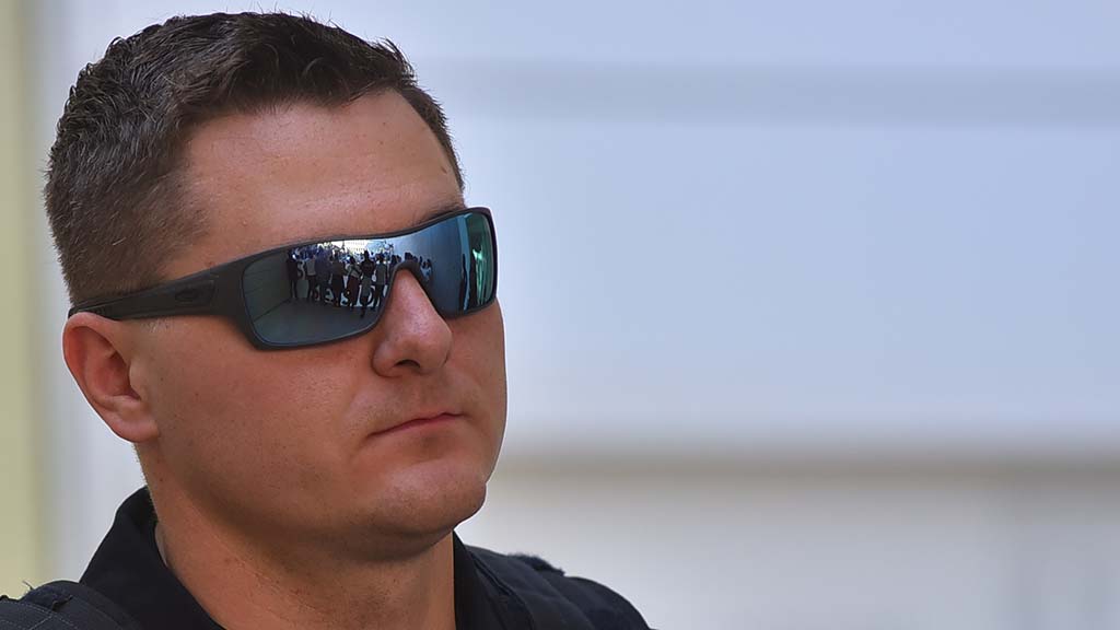 The protesters' blockade at the James Carter and Judith Keel can be seen in the sunglasses of a DHS agent.