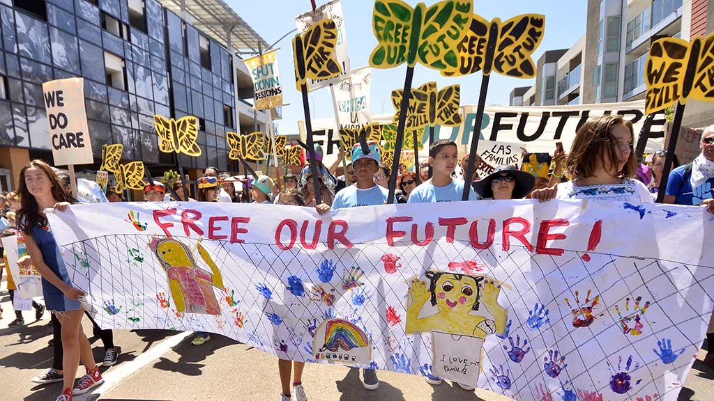 Children lead the Free Our Future march down National Avenue.