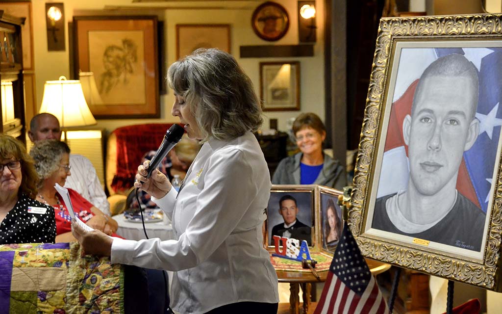 Genia Meyer, Gold Star mother of Brandon Meyer, reads from her daughter's tribute to her brother.