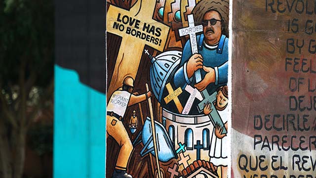 An image of Enrique Morones is part of a mural on a support structure in Chicano Park in Barrio Logan.