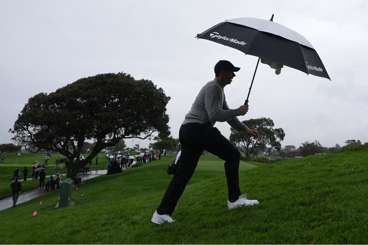 Top Golfers Drenched, Buffeted by Winds As Genesis Invitational Opens at Torrey Pines