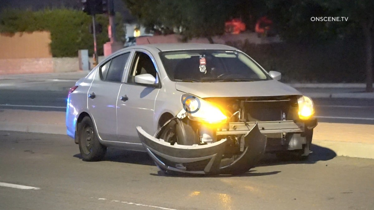 Two injured after e-bike runs red light, crashes into vehicle