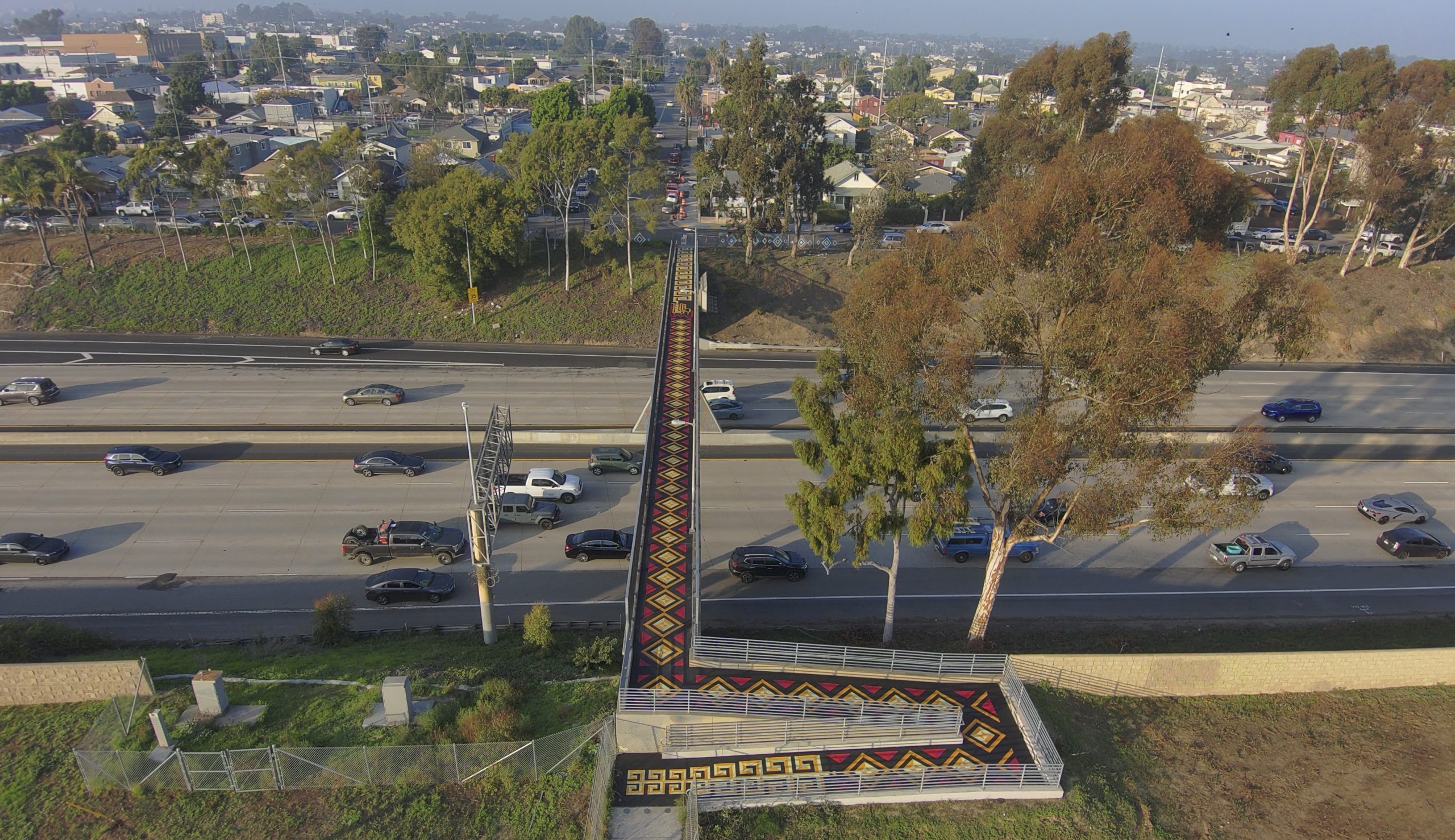 New mural between Barrio Logan, Logan Heights reclaims bridge as canvas for community history