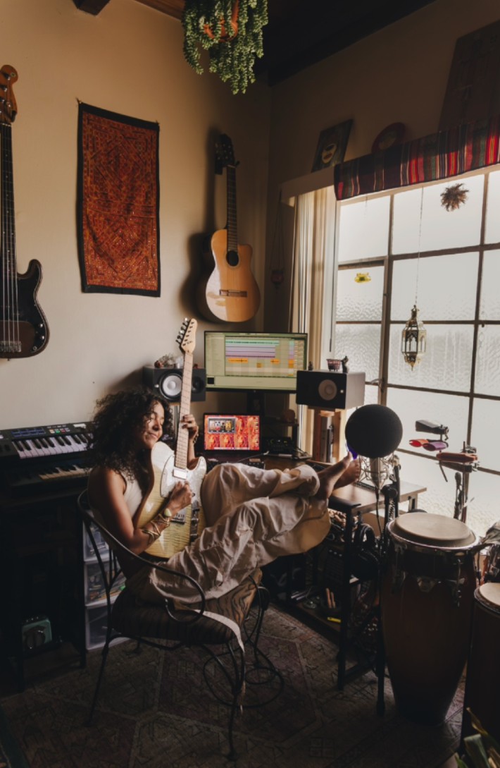 Divina makes a living in the tough independent music scene by wearing many hats and playing all over town